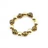 Bracelet doré avec boules léopard