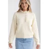 Pull femme pastel à col volanté