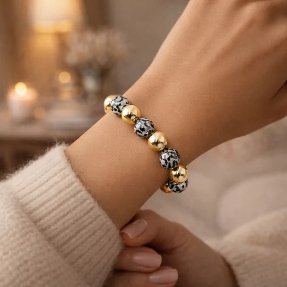 Bracelet doré avec boules léopard