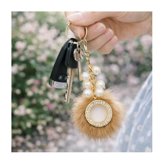 Porte clefs en acier et fausse fourrure